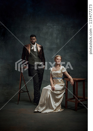 Cinematic portrait of royal family, elegant man and woman of Renaissance era posing against retro green background 115477273