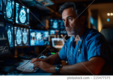 Middle-aged doctor checking brain x-ray results on a monitor at hospital. 115477375