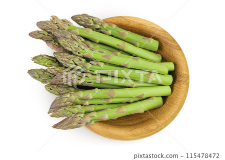 fresh asparagus in wooden bowl isolated on white background. Top view. Flat lay fresh asparagus in wooden bowl isolated on white background. Top view. Flat lay 115478472