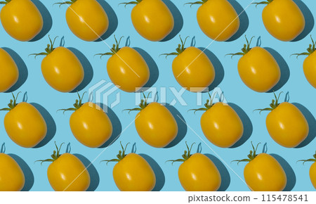 Yellow cherry tomato pattern on a blue background. Bright vegetable. Vitamin food 115478541