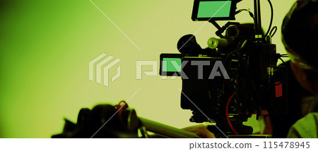 Filmmaker crew team with professional cinema equipment and video camera on the set. Film director and crew making commercial content advertising in studio. Technique of modern filming and advertising. Filmmaker crew team with professional cinema equipment and video camera on the set. Film director and crew making commercial content advertising in studio. Technique of modern filming and advertising. 115478945