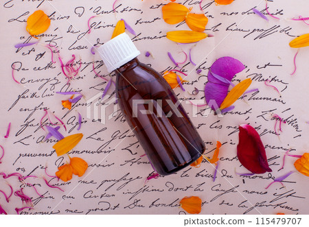 Amber Bottle with Handwritten Notes. Bach Therapy Concept Amber Bottle with Handwritten Notes. Bach Therapy Concept 115479707