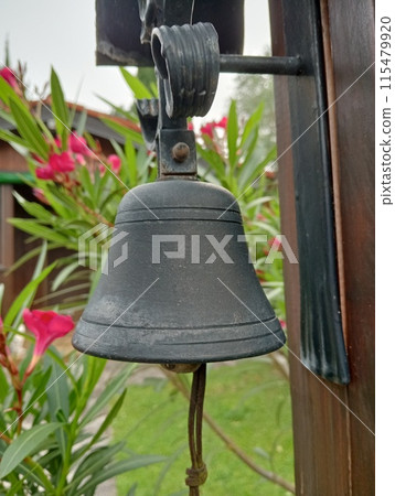 small bell with flowers in a garden 115479920