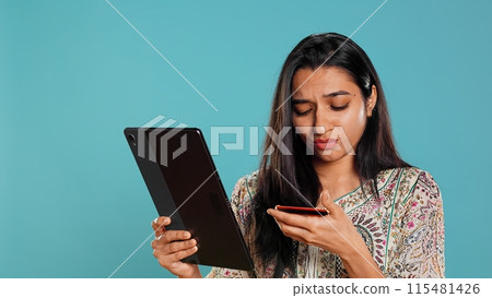 Woman trying to do purchases, frustrated with error received while adding payment method on website, studio background. Upset person unable to do internet shopping, getting card rejected, camera B Woman trying to do purchases, frustrated with error received while adding payment method on website, studio background. Upset person unable to do internet shopping, getting card rejected, camera B 115481426