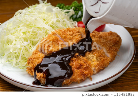 Crispy pork cutlet with sauce 115481982