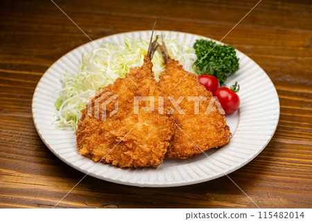 Crispy fried horse mackerel and shredded cabbage on a white plate 115482014