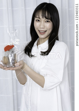 A woman with a present A woman with a present 115483311