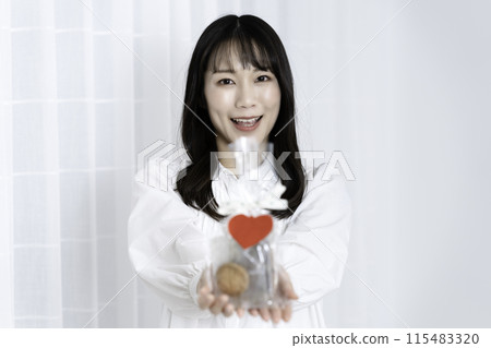 A woman with a present 115483320