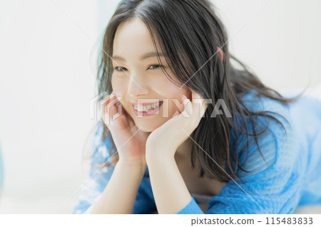 Young woman relaxing in a room Young woman relaxing in a room 115483833