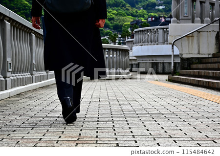 Back view of people walking on Atami Moon Terrace Back view of people walking on Atami Moon Terrace 115484642