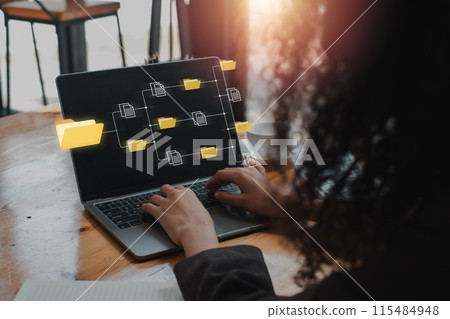 DMS, Document Management System concept, Businesswoman using lapop computer on desk with ocument Management System icon on virtual screen, searching, managing corporate files, Business processes. DMS, Document Management System concept, Businesswoman using lapop computer on desk with ocument Management System icon on virtual screen, searching, managing corporate files, Business processes. 115484948