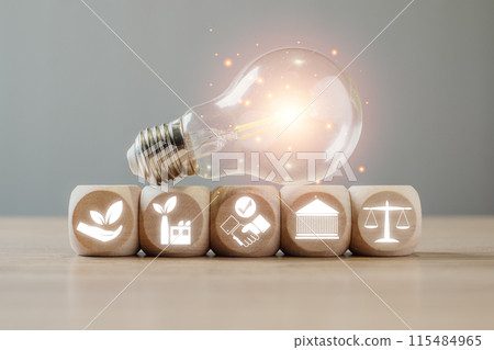 ESG, environment social governance concept, wooden block and light bulb on desk with ESG icon on virtual screen, Business cooperation for a sustainable environment, World sustainable environment. 115484965