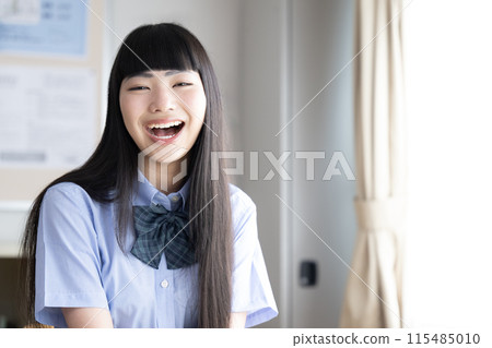 High school girls laughing out loud in the classroom. I got it! It gives the impression of improved grades and understanding. High school girls laughing out loud in the classroom. I got it! It gives the impression of improved grades and understanding. 115485010