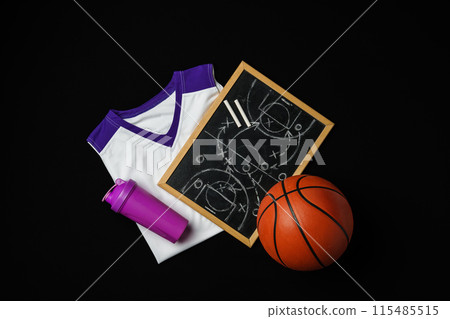 Basketball Strategy Planning With Chalkboard, Ball, and Jersey on Dark Background Basketball Strategy Planning With Chalkboard, Ball, and Jersey on Dark Background 115485515