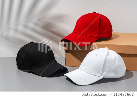 Baseball cap on gray background studio shot Baseball cap on gray background studio shot 115485608