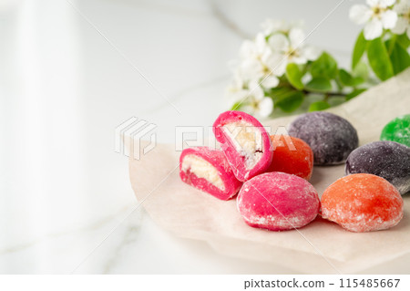 Multi-colored Japanese cakes Mochi in a white plate Multi-colored Japanese cakes Mochi in a white plate 115485667