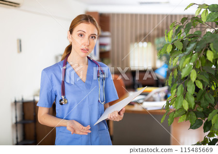 Worried female doctor explaining results of patient examination in office Worried female doctor explaining results of patient examination in office 115485669