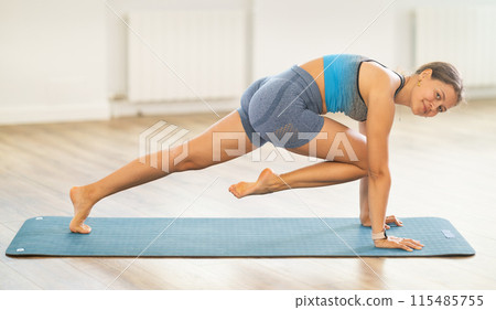 Different yoga poses performed by a slender girl in gym Different yoga poses performed by a slender girl in gym 115485755