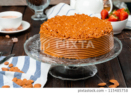 Plate with delicious caramel cake close up Plate with delicious caramel cake close up 115485758