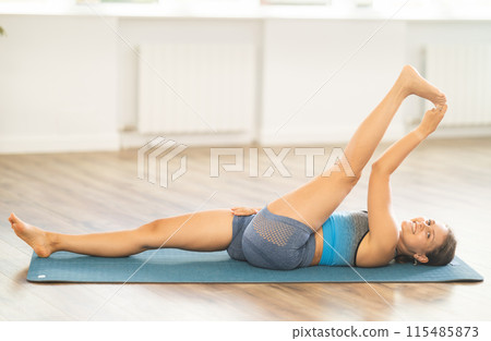 Different yoga poses performed by a slender girl in gym Different yoga poses performed by a slender girl in gym 115485873