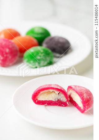 Multi-colored Japanese cakes Mochi in a white plate Multi-colored Japanese cakes Mochi in a white plate 115486014