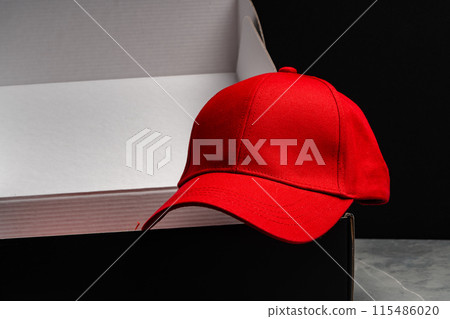 Baseball cap against black background studio shot Baseball cap against black background studio shot 115486020