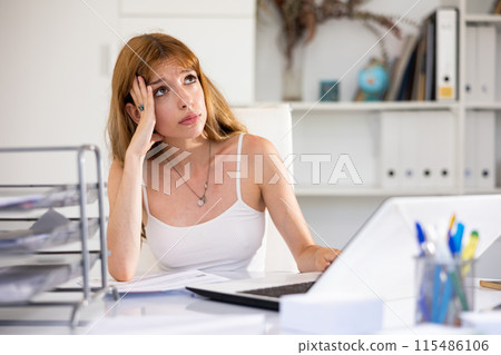 Angry female manager experiencing emotions in modern office 115486106