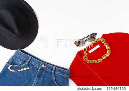Woman outfit with red sweater and accessories on white Woman outfit with red sweater and accessories on white 115486163