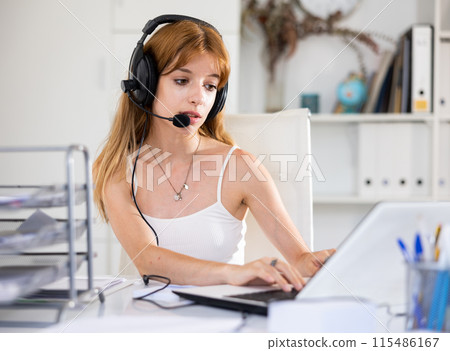 Portrait of young woman call center worker 115486167