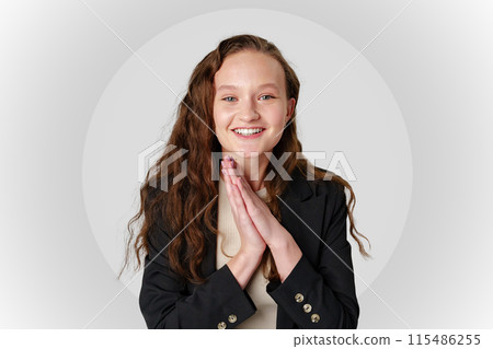 Startled Woman With Surprised Expression on gray background 115486255
