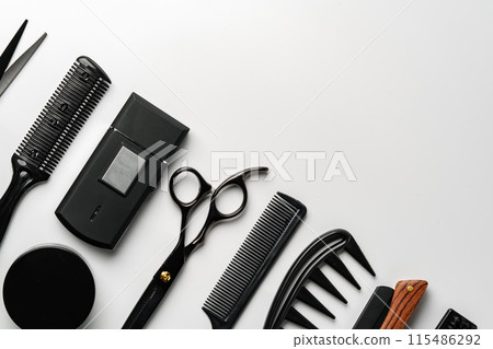 Set of barber tools for haircut on gray background flat lay Set of barber tools for haircut on gray background flat lay 115486292