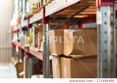 Modern warehouse shelves with pile of cardboard boxes Modern warehouse shelves with pile of cardboard boxes 115486490