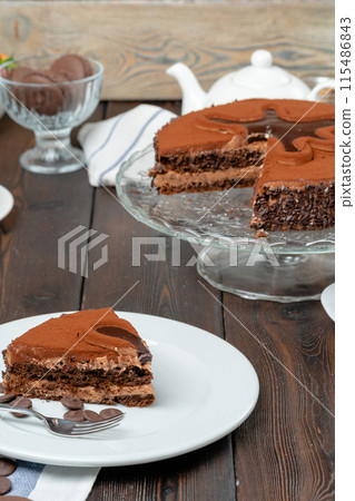 Chocolate cake with chocolate powder on top 115486843