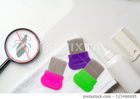 Comb, anti lice medicine and towel on white background Comb, anti lice medicine and towel on white background 115486895