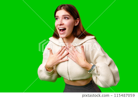 A woman wearing a skirt and sweater is striking a pose for a picture, standing confidently in front of the camera. 115487059