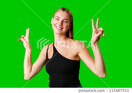Woman in Black Tank Top Making Peace Sign Woman in Black Tank Top Making Peace Sign 115487553