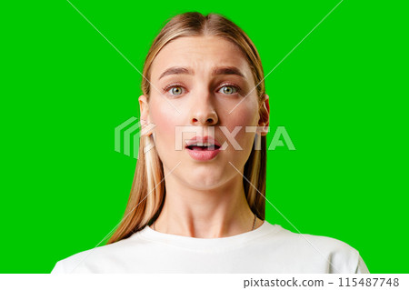 Young Woman in White T-shirt Making a Surprised Face Young Woman in White T-shirt Making a Surprised Face 115487748