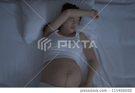 Depressed lonely Asian pregnant divorce woman in bedroom at home. Having a baby. Family people lifestyle. Mom. Depressed lonely Asian pregnant divorce woman in bedroom at home. Having a baby. Family people lifestyle. Mom. 115488088