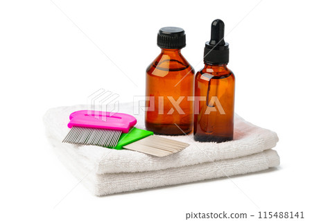 Comb, anti lice medicine and towel on white background Comb, anti lice medicine and towel on white background 115488141