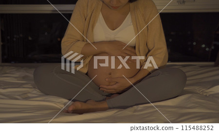 Depressed lonely Asian pregnant divorce woman in bedroom at home. Having a baby. Family people lifestyle. Mom. 115488252
