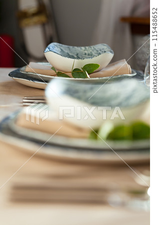 Elegant dinner table served for banquet event 115488652