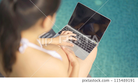 A portrait of happy Asian pregnant woman by the swimming pool. People lifestyle in travel holiday vacation concept. Relaxation. Having a baby. Family people lifestyle. Mom love. A portrait of happy Asian pregnant woman by the swimming pool. People lifestyle in travel holiday vacation concept. Relaxation. Having a baby. Family people lifestyle. Mom love. 115489191