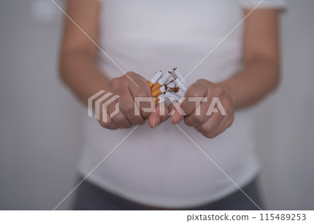 A Portrait of Asian pregnant woman smoking cigarette. Having a baby. Family people lifestyle. Mom love. A Portrait of Asian pregnant woman smoking cigarette. Having a baby. Family people lifestyle. Mom love. 115489253