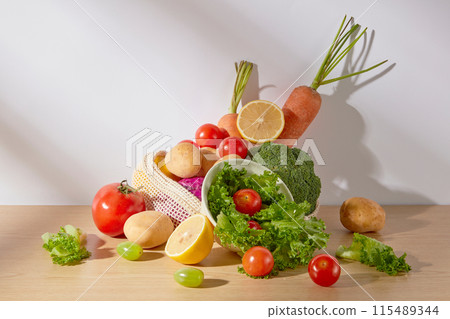 Creative photo for advertise product of natural ingredient, variety vegetables displayed in center, over white background. Frontal shot photo with vacant space for advertising 115489344