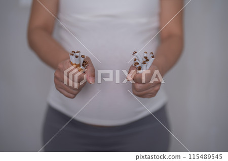 A Portrait of Asian pregnant woman smoking cigarette. Having a baby. Family people lifestyle. Mom love. A Portrait of Asian pregnant woman smoking cigarette. Having a baby. Family people lifestyle. Mom love. 115489545
