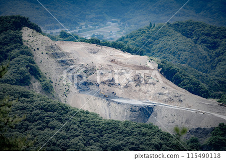 Mountain being cut down 115490118