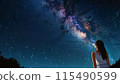 A woman looking up at the starry sky 115490599