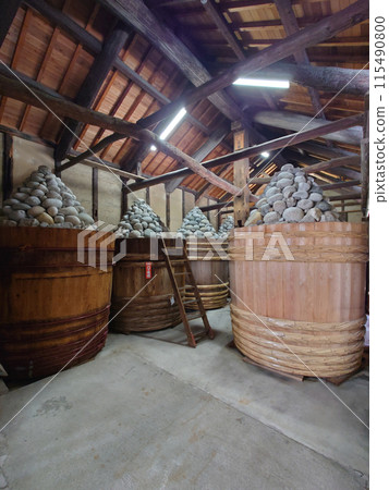 MISO barrels in old MISO warehouse / Inside the miso storehouse and miso barrels 115490800