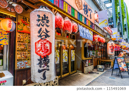 Tokyo cityscape in Japan: A view of Shibuya Yokocho in front of Shibuya Station, which stands out against the greenery in June. In the morning... = After 10 a.m. on the 12th 115491069