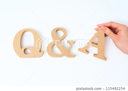 Wooden alphabet blocks arranged with the word "Q&A" 115492254